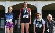 9 March 2019; Runners on the podium, from left, Leah Toher of Presentation College Headford, Co Galway, second place, Erin Leavy of St Vincent's Dundalk, Co Louth, first plce, and Gara Williams of Castleknock CC, third place, alongside Bill Delaney, President of Irish Schools Athletics Association, after the Minors Girls event in the Irish Life Health All Ireland Schools Cross Country at Clongowes Wood College in Clane, Co Kildare. Photo by Piaras Ó Mídheach/Sportsfile