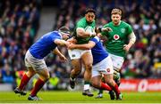 10 March 2019; Bundee Aki of Ireland is tackled by Dorian Aldegheri, left, and Guilhem Guirado of France during the Guinness Six Nations Rugby Championship match between Ireland and France at the Aviva Stadium in Dublin. Photo by Ramsey Cardy/Sportsfile