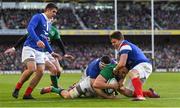 10 March 2019; Jack Conan of Ireland dives over to score his side's third try despite the tackle of Guilhem Guirado and Antoine Dupont of France during the Guinness Six Nations Rugby Championship match between Ireland and France at the Aviva Stadium in Dublin. Photo by Ramsey Cardy/Sportsfile