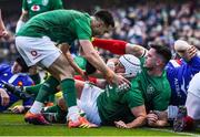 10 March 2019; Rory Best of Ireland is congratulated by team-mates Conor Murray, left, and James Ryan after scoring his side's first try despite the efforts of Antoine Dupont of France during the Guinness Six Nations Rugby Championship match between Ireland and France at the Aviva Stadium in Dublin. Photo by Brendan Moran/Sportsfile