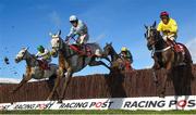 12 March 2019; Activial, with Tom Scudmore, up, jumps the last alongside runners and riders during the Ultima Handicap Chase on Day One of the Cheltenham Racing Festival at Prestbury Park in Cheltenham, England. Photo by David Fitzgerald/Sportsfile