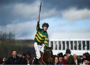 12 March 2019; Mark Walsh celebrates on Espoir D'allen after winning the Unibet Champion Hurdle Challenge Trophy on day one of the Cheltenham Racing Festival at Prestbury Park in Cheltenham, England. Photo by David Fitzgerald/Sportsfile