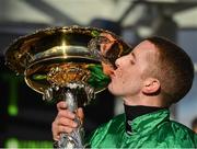 12 March 2019; Jockey Mark Walsh celebrates with the trophy after winning the Unibet Champion Hurdle Challenge Trophy on Espoir D'Allen on Day One of the Cheltenham Racing Festival at Prestbury Park in Cheltenham, England. Photo by Seb Daly/Sportsfile