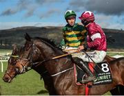 12 March 2019; Jockey Mark Walsh, left, is congratulated by Jack Kennedy, right, on Apple's Jade, after winning the Unibet Champion Hurdle Challenge Trophy on Espoir D'Allen on Day One of the Cheltenham Racing Festival at Prestbury Park in Cheltenham, England. Photo by Seb Daly/Sportsfile
