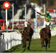 12 March 2019; Jockey Mark Walsh celebrates as he crosses the line to win the Unibet Champion Hurdle Challenge Trophy on Espoir D'Allen on Day One of the Cheltenham Racing Festival at Prestbury Park in Cheltenham, England. Photo by Seb Daly/Sportsfile