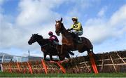 12 March 2019; Eventual second Melon, with Paul Townend, up, right, jump the last next to Apple's Jade, with Jack Kennedy, up, during the Unibet Champion Hurdle Challenge Trophy on Day One of the Cheltenham Racing Festival at Prestbury Park in Cheltenham, England. Photo by David Fitzgerald/Sportsfile