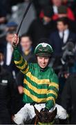 12 March 2019; Jockey Mark Walsh celebrates after winning the Unibet Champion Hurdle Challenge Trophy on Espoir D'Allen on Day One of the Cheltenham Racing Festival at Prestbury Park in Cheltenham, England. Photo by Seb Daly/Sportsfile