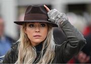 13 March 2019; A racegoer holds onto her hat as she arrives prior to racing on Day Two of the Cheltenham Racing Festival at Prestbury Park in Cheltenham, England. Photo by Seb Daly/Sportsfile