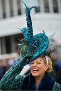 13 March 2019; A racegoer holds onto her hat as she arrives prior to racing on Day Two of the Cheltenham Racing Festival at Prestbury Park in Cheltenham, England. Photo by Seb Daly/Sportsfile