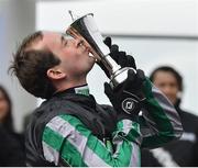 13 March 2019; Jockey Nico de Boinville kisses the trophy after winning the Betway Queen Mother Champion Chase on Altior on Day Two of the Cheltenham Racing Festival at Prestbury Park in Cheltenham, England. Photo by Seb Daly/Sportsfile