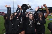 13 March 2019; Ciara McNamara of University College Cork and her teammates celebrate with the Kelly Cup after the WSCAI Kelly Cup Final match between University College Cork and Maynooth University at Seaview in Belfast. Photo by Oliver McVeigh/Sportsfile