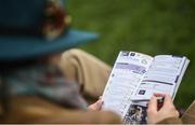 14 March 2019; Racegoers study the racecard prior to racing on Day Three of the Cheltenham Racing Festival at Prestbury Park in Cheltenham, England. Photo by David Fitzgerald/Sportsfile