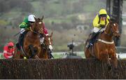 14 March 2019; Defi Du Seuil, with Barry Geraghty up, left, jumps the last alongside eventual second LostInTranslation, with Robbie Power up, on their way to winning the JLT Novices' Chase on Day Three of the Cheltenham Racing Festival at Prestbury Park in Cheltenham, England. Photo by David Fitzgerald/Sportsfile