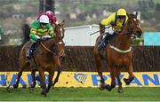 14 March 2019; Defi Du Seuil, with Barry Geraghty up, left, races ahead of eventual second LostInTranslation, with Robbie Power up, on their way to winning the JLT Novices' Chase on Day Three of the Cheltenham Racing Festival at Prestbury Park in Cheltenham, England. Photo by David Fitzgerald/Sportsfile