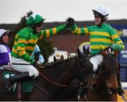 14 March 2019; Jockey Derek O'Connor, right, is congratulated by Mark O'Hare after winning the Fulke Walwyn Kim Muir Challenge Cup Amateur Riders' Handicap Chase on Any Second Now on Day Three of the Cheltenham Racing Festival at Prestbury Park in Cheltenham, England. Photo by Seb Daly/Sportsfile