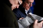 15 March 2019; Racegoers study the form prior to racing on Day Four of the Cheltenham Racing Festival at Prestbury Park in Cheltenham, England. Photo by David Fitzgerald/Sportsfile