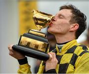 15 March 2019; Jockey Paul Townend celebrates with the trophy after winning the Magners Cheltenham Gold Cup Chase on Al Boum Photo on Day Four of the Cheltenham Racing Festival at Prestbury Park in Cheltenham, England. Photo by Seb Daly/Sportsfile