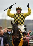 15 March 2019; Jockey Paul Townend celebrates as he enters the winners enclosure after winning the Magners Cheltenham Gold Cup Chase on al Boum Photo on Day Four of the Cheltenham Racing Festival at Prestbury Park in Cheltenham, England. Photo by Seb Daly/Sportsfile