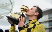 15 March 2019; Paul Townend celebrates with the Gold Cup after riding Al Boum Photo to win the Magners Cheltenham Gold Cup Chase on Day Four of the Cheltenham Racing Festival at Prestbury Park in Cheltenham, England. Photo by David Fitzgerald/Sportsfile