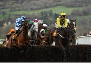 15 March 2019; Al Boum Photo, right, with Paul Townend up, jumps the last, alongside Double Shuffle, with Jonathan Burke up, during the first circuit on their way to winning the Magners Cheltenham Gold Cup Chase on Day Four of the Cheltenham Racing Festival at Prestbury Park in Cheltenham, England. Photo by Seb Daly/Sportsfile