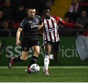 15 March 2019; Michael Duffy of Dundalk in action against Junior Ogedi-Uzokwe of Derry City during the SSE Airtricity League Premier Division match between Derry City and Dundalk at Ryan McBride Brandywell Stadium in Derry Photo by Oliver McVeigh/Sportsfile