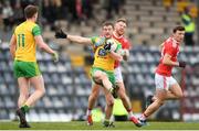 16 March 2019; Leo McLoone of Donegal is tackled by Killian O'Hanlon of Cork during the Allianz Football League Division 2 Round 6 match between Cork and Donegal at Páirc Uí Rinn in Cork. Photo by Eóin Noonan/Sportsfile