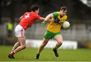 16 March 2019; Jamie Brennan of Donegal is tackled by Conor Dennehy of Cork during the Allianz Football League Division 2 Round 6 match between Cork and Donegal at Páirc Uí Rinn in Cork. Photo by Eóin Noonan/Sportsfile