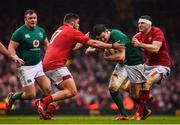 16 March 2019; Jonathan Sexton of Ireland is tackled by Nicky Smith, left, and Hadleigh Parkes of Wales during the Guinness Six Nations Rugby Championship match between Wales and Ireland at the Principality Stadium in Cardiff, Wales. Photo by Ramsey Cardy/Sportsfile
