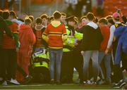 17 March 2019; A supporter is arrested by a member of An Garda Síochána on the pitch following the Clayton Hotels Munster Schools Senior Cup Final match between Christian Brothers College and Presentation Brothers College at Irish Independent Park in Cork. Photo by Eóin Noonan/Sportsfile