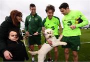 18 March 2019; Republic of Ireland players, from left, Kevin Long, Jeff Hendrick and Robbie Brady meet Susan and Adam Grainer with Bella, from My Canine Companion, during a Republic of Ireland training session at the FAI National Training Centre in Abbotstown, Dublin. Photo by Stephen McCarthy/Sportsfile