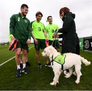 18 March 2019; Republic of Ireland players, from left, Kevin Long, Jeff Hendrick and Robbie Brady meet Susan and Adam Grainer with Bella, from My Canine Companion, during a Republic of Ireland training session at the FAI National Training Centre in Abbotstown, Dublin. Photo by Stephen McCarthy/Sportsfile