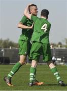 19 March 2019; Team Ireland's William McGrath, 4, a member of Waterford SO Clubs, from Kilmacthomas, Co. Waterford, celebrates with Team Ireland's Wayne O'Callaghan, a member of the Ballincollig SO Club, from Vicarstown, Co. Cork, after he scored the 4th goal when Team Ireland beat SO Estonia 7-2 to take the Bronze medal place on Day Five of the 2019 Special Olympics World Games in Zayed Sports City, Airport Road, Abu Dhabi, United Arab Emirates. Photo by Ray McManus/Sportsfile