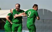 19 March 2019; Team Ireland's Steven O'Leary, 9, a member of the Ballincollig SO Club, from Fermoy, Co. Cork, and Team Ireland's Patrick Furlong, a member of the Lakers, from Dublin 10, Co. Dublin, after he scored the 5th goal when Team Ireland beat SO Estonia 7-2 to take the Bronze medal place on Day Five of the 2019 Special Olympics World Games in Zayed Sports City, Airport Road, Abu Dhabi, United Arab Emirates.  Photo by Ray McManus/Sportsfile