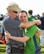 20 March 2019; Team Ireland's Andrew Simington, a member of Blackrock Flyers Special Olympics Club, from Dalkey, Co. Dublin, is photographed with his dad Sam after he had collected the Gold Medal in the Level 2 - Unified Alternate Shot Team Play Competition on Day Six of the 2019 Special Olympics World Games in Yas Links, Yas Island, Abu Dhabi, United Arab Emirates  Photo by Ray McManus/Sportsfile