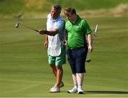 20 March 2019; Team Ireland's Mark Claffey, a member of the Blackrock Flyers Special Olympics Club, from Blackrock, Co. Dublin, and his caddy Rob Sherman during his Gold Medal round in the Level 4 - Individual Stroke Play Competition on Day Six of the 2019 Special Olympics World Games in Yas Links, Yas Island, Abu Dhabi, United Arab Emirates  Photo by Ray McManus/Sportsfile