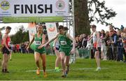 23 March 2019; Ava O'Connor of Scoil Chriost Ri Portloaise, Co.Laois, Ireland, left, passes over to Matthew Lavery of St Malachys College, Co.Antrim, Ireland, whilst competing in the mixed relay event during the SIAB Schools Cross Country International at Santry Demense in Santry, Dublin. Photo by Sam Barnes/Sportsfile
