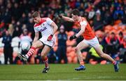 24 March 2019; Ian Maguire of Cork in action against Jarlath Og Burns of Armagh during the Allianz Football League Division 2 Round 7 match between Armagh and Cork at the Athletic Grounds in Armagh. Photo by Ramsey Cardy/Sportsfile