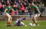 24 March 2019; Conor McManus of Monaghan after being tackled by Brendan Harrison of Mayo, right, as Chris Barrett looks on during the Allianz Football League Division 1 Round 7 match between Mayo and Monaghan at Elverys MacHale Park in Castlebar, Mayo. Photo by Piaras Ó Mídheach/Sportsfile