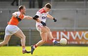 24 March 2019; Kevin Crowley of Cork shoots to score his side's third goal of the game despite the attention of Ryan Kennedy of Armagh during the Allianz Football League Division 2 Round 7 match between Armagh and Cork at the Athletic Grounds in Armagh. Photo by Ramsey Cardy/Sportsfile