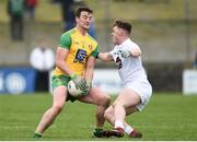 24 March 2019; Leo McLoone of Donegal in action against Jimmy Hyland of Kildare during the Allianz Football League Division 2 Round 7 match between Donegal and Kildare at Fr. Tierney Park in Ballyshannon, Donegal. Photo by Oliver McVeigh/Sportsfile