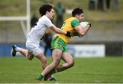 24 March 2019; Caolan McGonigle of Donegal in action against Chris Healy of Kildare during the Allianz Football League Division 2 Round 7 match between Donegal and Kildare at Fr. Tierney Park in Ballyshannon, Donegal. Photo by Oliver McVeigh/Sportsfile