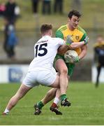 24 March 2019; Leo McLoone of Donegal in action against Jimmy Hyland of Kildare during the Allianz Football League Division 2 Round 7 match between Donegal and Kildare at Fr. Tierney Park in Ballyshannon, Donegal. Photo by Oliver McVeigh/Sportsfile