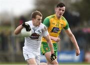 24 March 2019; Peter Kelly of Kildare in action against Jason McGee of Donegal during the Allianz Football League Division 2 Round 7 match between Donegal and Kildare at Fr. Tierney Park in Ballyshannon, Donegal. Photo by Oliver McVeigh/Sportsfile