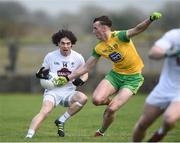24 March 2019; Chris Healy of Kildare  in action against Jason McGee of Donegal  during the Allianz Football League Division 2 Round 7 match between Donegal and Kildare at Fr. Tierney Park in Ballyshannon, Donegal. Photo by Oliver McVeigh/Sportsfile