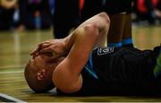 24 March 2019; Kieran Donaghy of Garvey's Tralee Warriors holds his mouth after a collision with  Mike Garrow of UCD Marian during the Basketball Ireland Men's Superleague match between Garvey's Warriors Tralee and UCD Marian in the Tralee Sports Complex in Tralee, Co. Kerry. Photo by Diarmuid Greene/Sportsfile