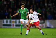 24 March 2019; Pavel Savitski of Belarus in action against Jamal Lewis of Northern Ireland during the UEFA EURO2020 Qualifier Group C match between Northern Ireland and Belarus at the National Football Stadium in Windsor Park, Belfast. Photo by Ramsey Cardy/Sportsfile