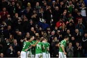 24 March 2019; Jonny Evans of Northern Ireland celebrates with team-mates after scoring his side's first goal of the game during the UEFA EURO2020 Qualifier Group C match between Northern Ireland and Belarus at the National Football Stadium in Windsor Park, Belfast. Photo by Ramsey Cardy/Sportsfile