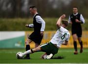 25 March 2019; Adrian Rafferty of Defence Forces is tackled by Rob Slevin of Colleges & Universities during the match between Colleges & Universities and Defence Forces at  Athlone Town Stadium in Athlone, Co. Westmeath. Photo by Harry Murphy/Sportsfile