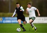 25 March 2019; Conor Kane of Colleges & Universities in action against Aidan Friel of Defence Forces during the match between Colleges & Universities and Defence Forces at  Athlone Town Stadium in Athlone, Co. Westmeath. Photo by Harry Murphy/Sportsfile