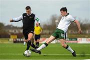 25 March 2019; Aidan Friel of Defence Forces in action against Simon Falvey of Colleges & Universities during the match between Colleges & Universities and Defence Forces at  Athlone Town Stadium in Athlone, Co. Westmeath. Photo by Harry Murphy/Sportsfile